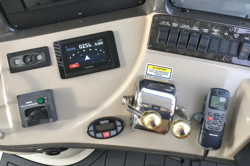 Slide: The Image of Control panel of a 2005 Sea Ray 420 Sundancer with navigation and communication equipment. - 17