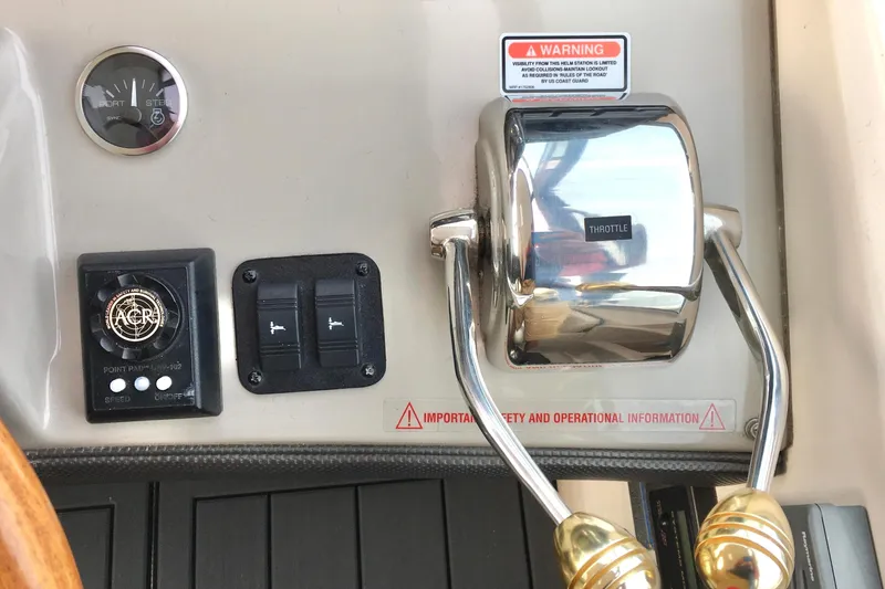 Slide: The Image of Control panel of a 2005 Sea Ray 420 Sundancer boat with throttle and switches. - 18