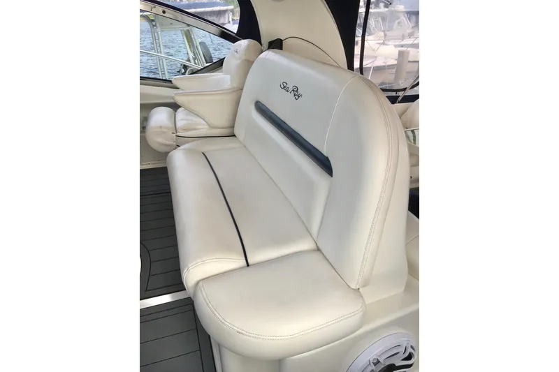 Slide: The Image of Luxurious seating on 2005 Sea Ray 420 Sundancer yacht, featuring elegant white upholstery. - 19