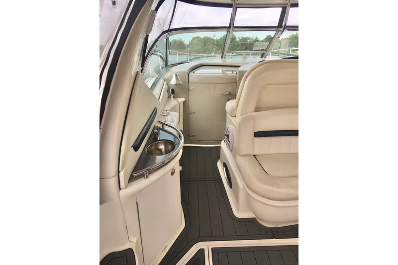 Slide: The Image of 2005 Sea Ray 420 Sundancer interior with beige seating and sleek design. - 21