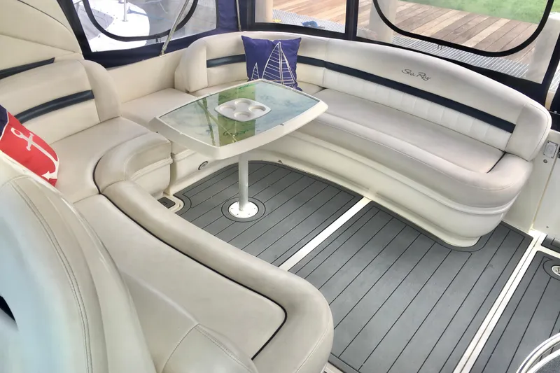 Slide: The Image of Luxurious interior of 2005 Sea Ray 420 Sundancer with elegant seating and table. - 22