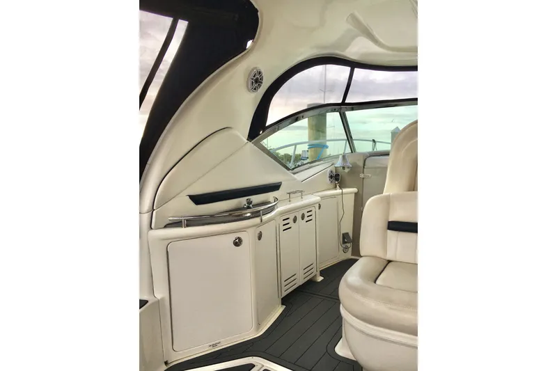 Slide: The Image of Interior of 2005 Sea Ray 420 Sundancer yacht, featuring sleek seating and cabinetry. - 27