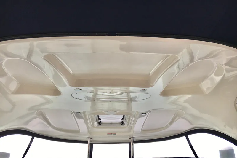 Slide: The Image of Ceiling view of 2005 Sea Ray 420 Sundancer boat interior, featuring sleek design elements. - 28