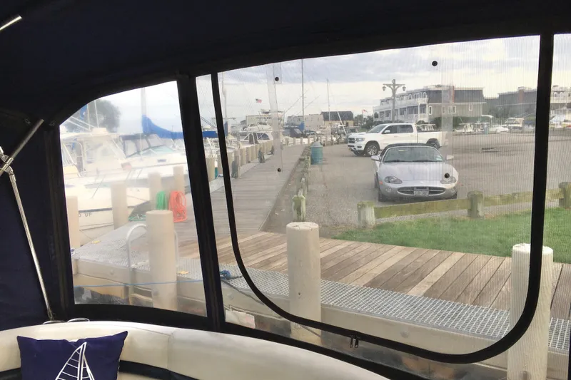 Slide: The Image of 2005 Sea Ray 420 Sundancer view from cabin, overlooking marina and parked cars. - 29