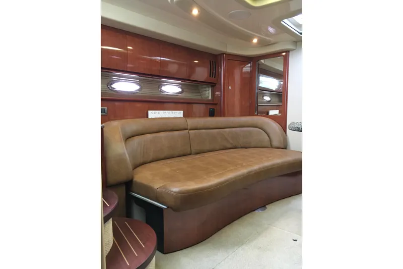 Slide: The Image of Luxurious interior of 2005 Sea Ray 420 Sundancer with leather seating and wood finishes. - 39