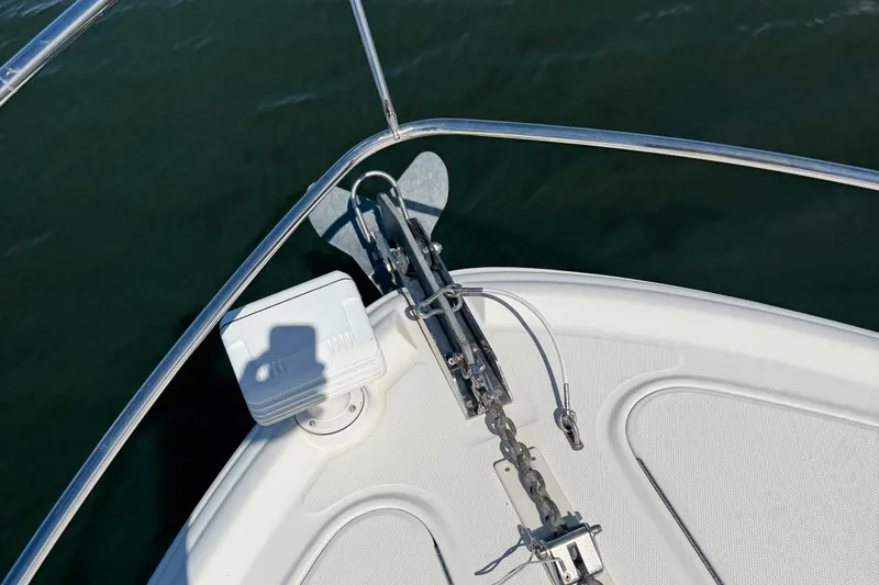 Slide: The Image of Bow of 2005 Sea Ray 420 Sundancer with anchor and railing over water. - 4