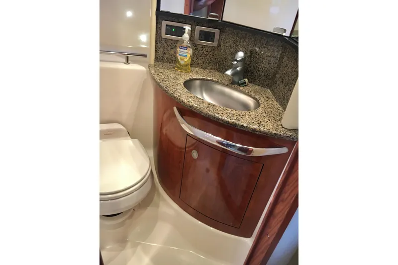 Slide: The Image of Luxurious bathroom in 2005 Sea Ray 420 Sundancer yacht with granite countertop and modern fixtures. - 47