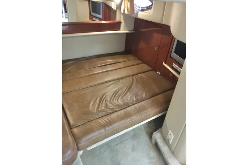 Slide: The Image of Interior of 2005 Sea Ray 420 Sundancer with leather seating and built-in TV. - 54