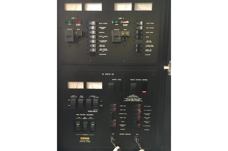 Slide: The Image of Electrical control panel of a 2005 Sea Ray 420 Sundancer boat. - 56