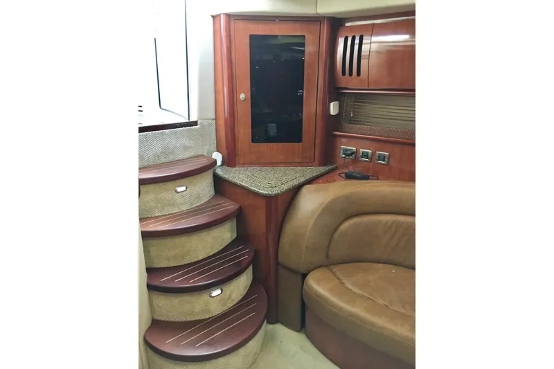 Slide: The Image of Interior of 2005 Sea Ray 420 Sundancer with wooden stairs and leather seating. - 57