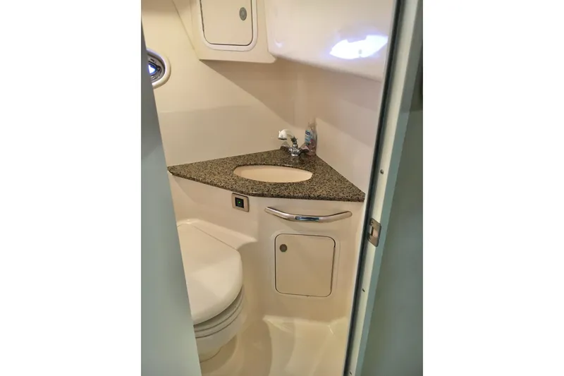 Slide: The Image of 2005 Sea Ray 420 Sundancer bathroom with granite countertop and compact design. - 60