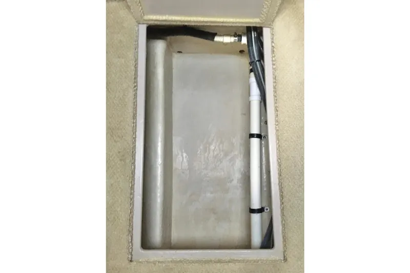 Slide: The Image of 2005 Sea Ray 420 Sundancer interior compartment with visible wiring and piping. - 61