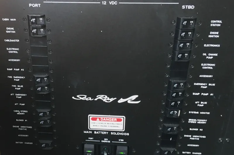 Slide: The Image of Control panel of a 2005 Sea Ray 420 Sundancer boat with labeled switches. - 63