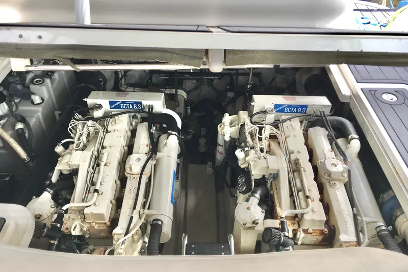 Slide: The Image of Engine compartment of a 2005 Sea Ray 420 Sundancer with twin Cummins 6CTA 8.3 engines. - 64