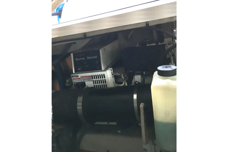 Slide: The Image of Engine compartment of a 2005 Sea Ray 420 Sundancer with marine generator. - 66