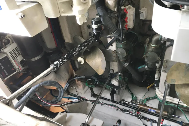 Slide: The Image of Engine room of 2005 Sea Ray 420 Sundancer with visible propeller and mechanical components. - 67