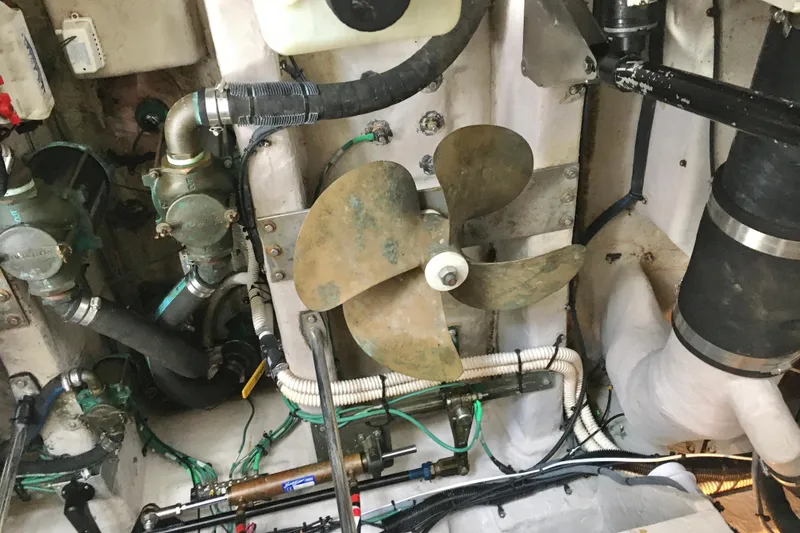 Slide: The Image of Engine room of 2005 Sea Ray 420 Sundancer with visible propeller and mechanical components. - 68