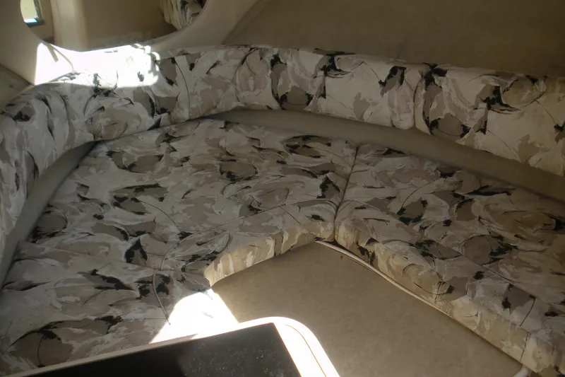 Slide: The Image of Interior seating of 2000 Sea Ray 240 Sundancer with patterned upholstery. - 2