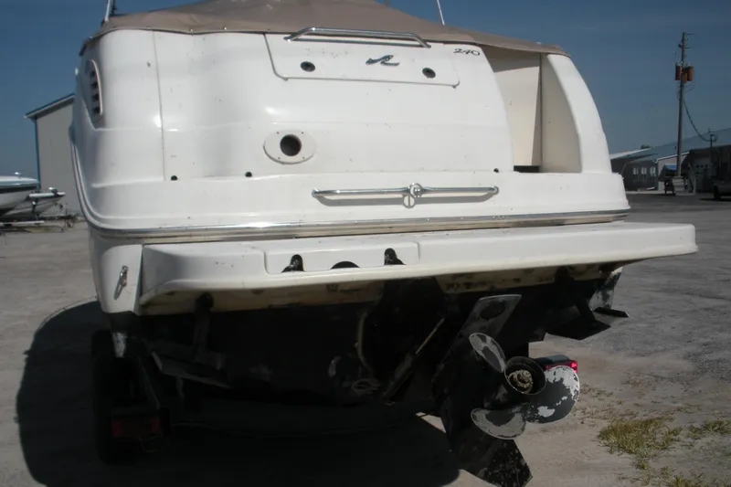 Slide: The Image of Rear view of a 2000 Sea Ray 240 Sundancer boat on a trailer. - 21