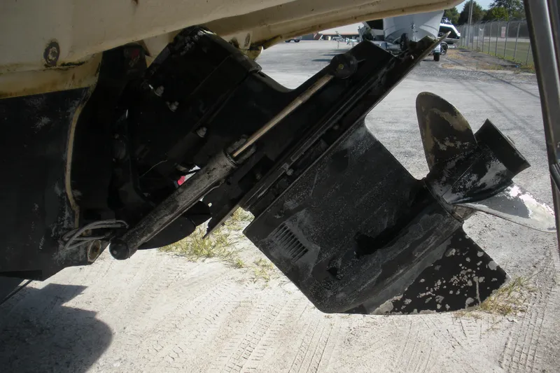 Slide: The Image of Close-up of a 2000 Sea Ray 240 Sundancer boat propeller and outdrive on dry land. - 22