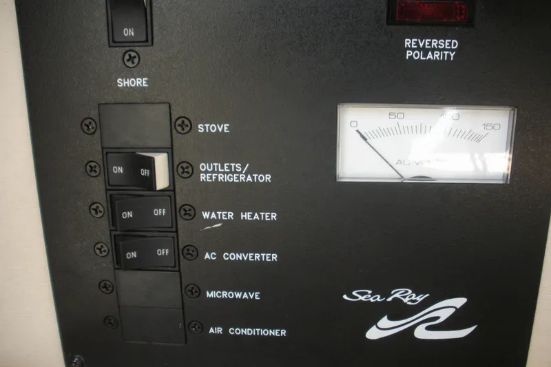 Slide: The Image of Electrical panel of 2000 Sea Ray 240 Sundancer boat with switches and voltage meter. - 5