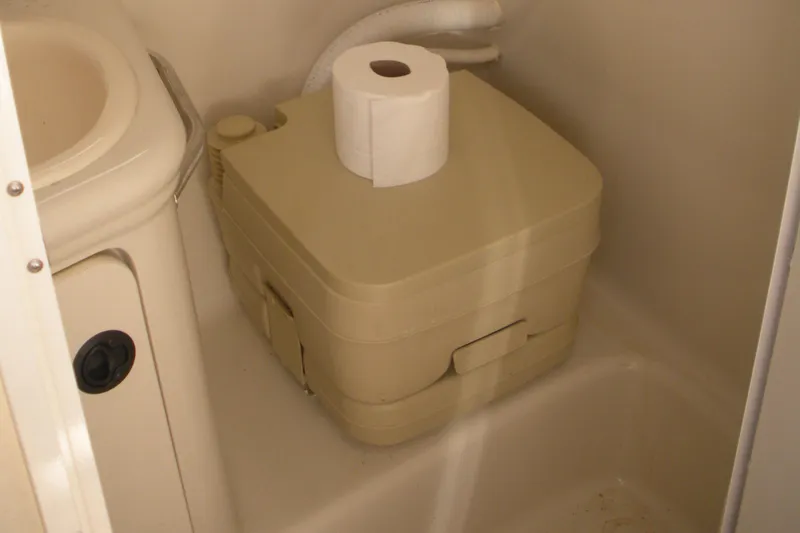 Slide: The Image of Portable toilet in 2000 Sea Ray 240 Sundancer boat bathroom. - 6
