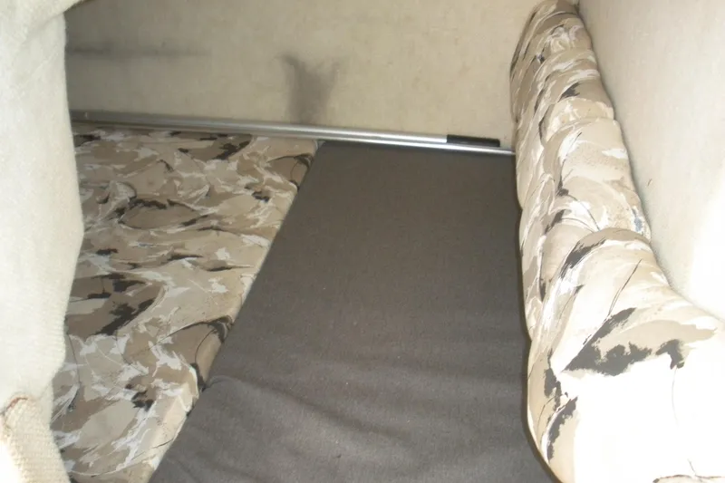 Slide: The Image of Interior cabin of 2000 Sea Ray 240 Sundancer with camouflage-patterned upholstery. - 7