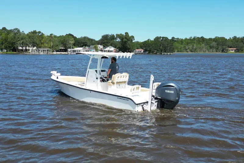 Slide: The Image of 2024 Clark Sound 24 boat cruising on a lake with Yamaha engine. - 3