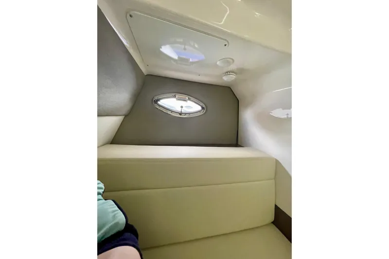 Slide: The Image of Interior cabin of 2023 Chaparral 280 OSX boat with porthole and seating. - 34