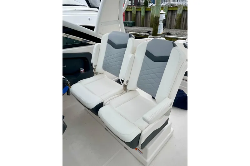Slide: The Image of 2023 Chaparral 280 OSX boat seats, featuring modern white and gray design. - 36