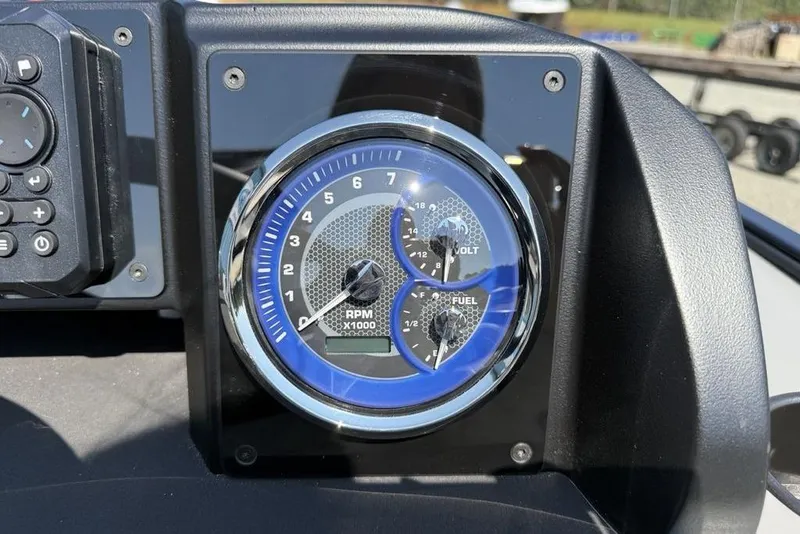 Slide: The Image of Dashboard of 2026 Premier 220 Sunscape RF with RPM, volt, and fuel gauges. - 10