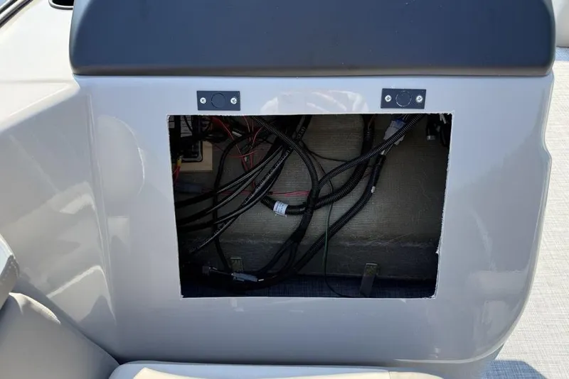 Slide: The Image of Open panel showing wiring inside 2026 Premier 220 Sunscape RF boat. - 13
