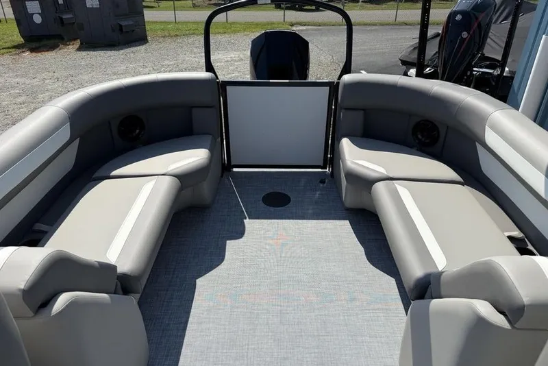 Slide: The Image of 2026 Premier 220 Sunscape RF pontoon boat interior with gray seating and open deck. - 19