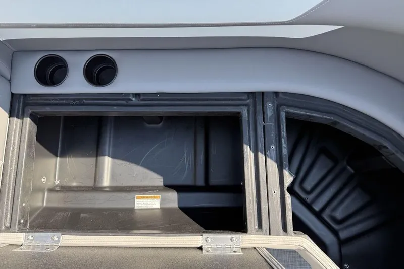 Slide: The Image of Interior storage compartment of 2026 Premier 220 Sunscape RF boat, featuring dual vents. - 22