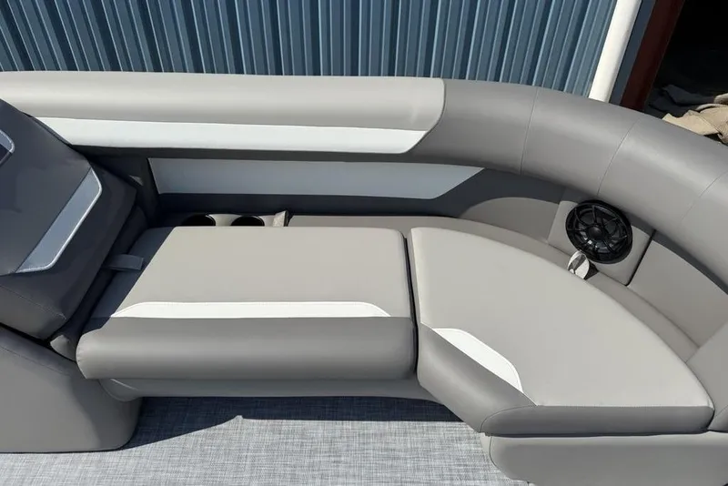 Slide: The Image of Luxurious seating on 2026 Premier 220 Sunscape RF boat with cup holders and speaker. - 7