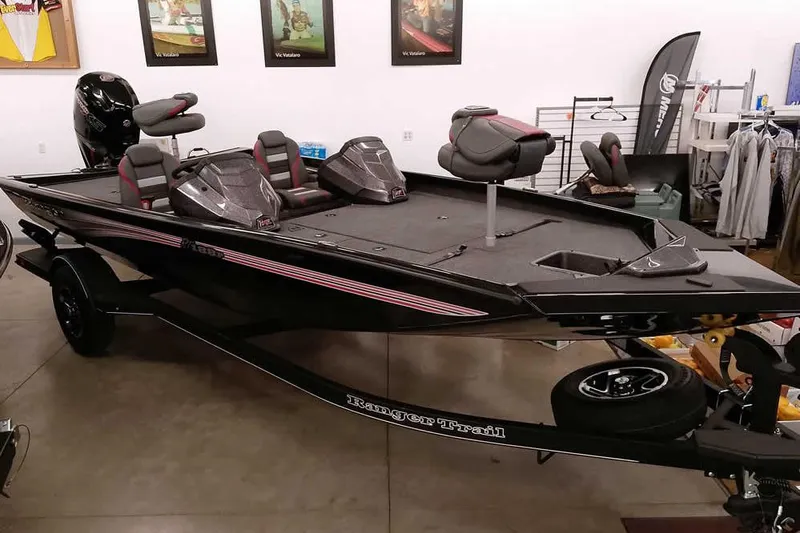 The Image of 2026 Ranger RT188P bass boat in showroom, featuring sleek design and modern seating. - 1