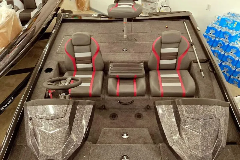 Slide: The Image of 2026 Ranger RT188P boat interior with dual seats, steering wheel, and storage compartments. - 16