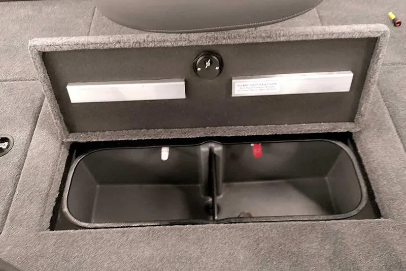 Slide: The Image of 2026 Ranger RT188P boat storage compartment with open lid and interior view. - 22