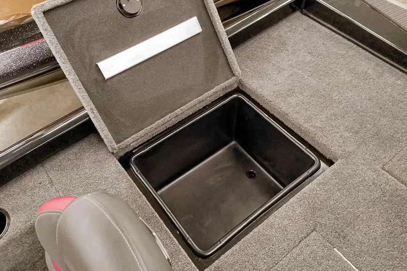 Slide: The Image of 2026 Ranger RT188P boat storage compartment with open lid, showcasing interior space. - 24
