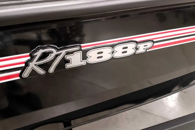 Slide: The Image of 2026 Ranger RT188P boat logo with red and white stripes on black surface. - 4