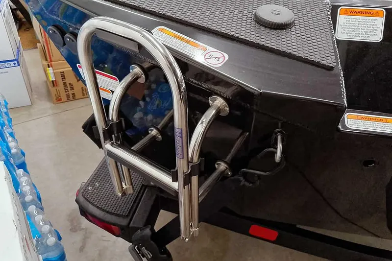 Slide: The Image of 2026 Ranger RT188P boat with stainless steel boarding ladder and safety warnings. - 6