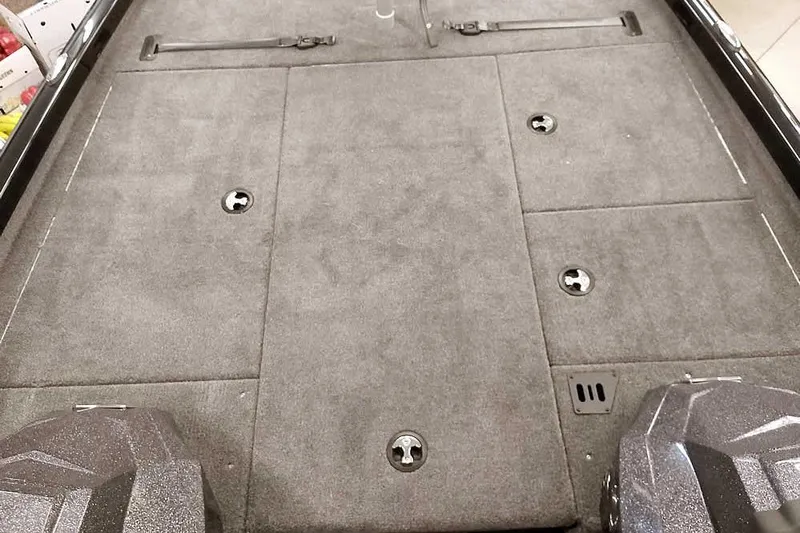 Slide: The Image of 2026 Ranger RT188P boat deck with storage compartments and carpeted surface. - 9