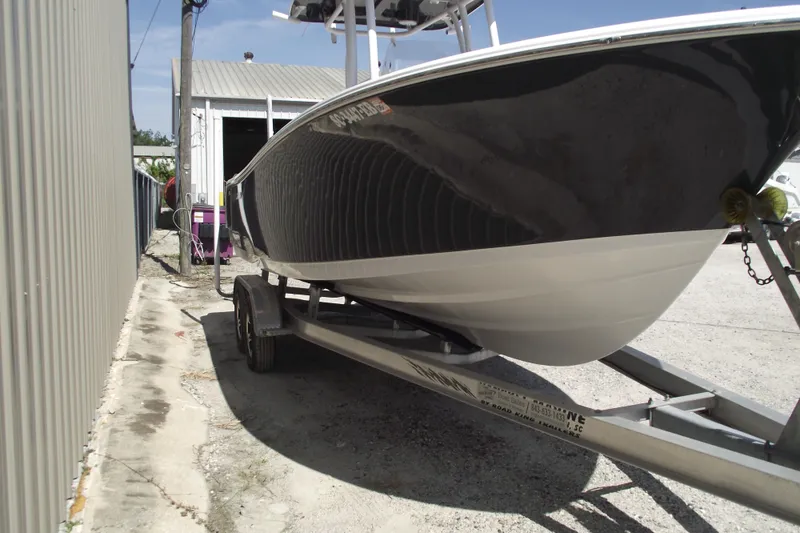 Slide: The Image of 2022 Sportsman Open 232 Center Console boat on trailer. - 2