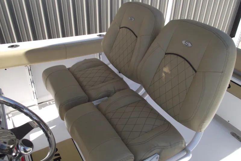 Slide: The Image of 2022 Sportsman Open 232 Center Console boat seats with diamond-stitched upholstery. - 26