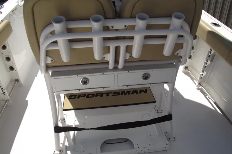 Slide: The Image of 2022 Sportsman Open 232 Center Console boat interior with rod holders and storage. - 29