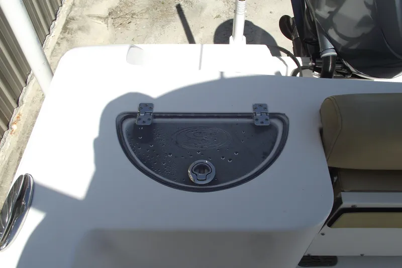 Slide: The Image of 2022 Sportsman Open 232 Center Console boat with wet deck and seating area. - 31