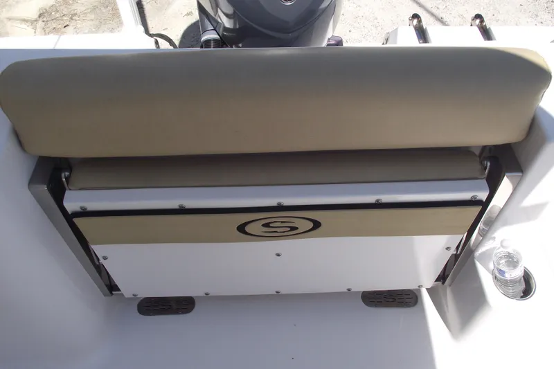 Slide: The Image of 2022 Sportsman Open 232 Center Console boat seat with logo and cup holder. - 33