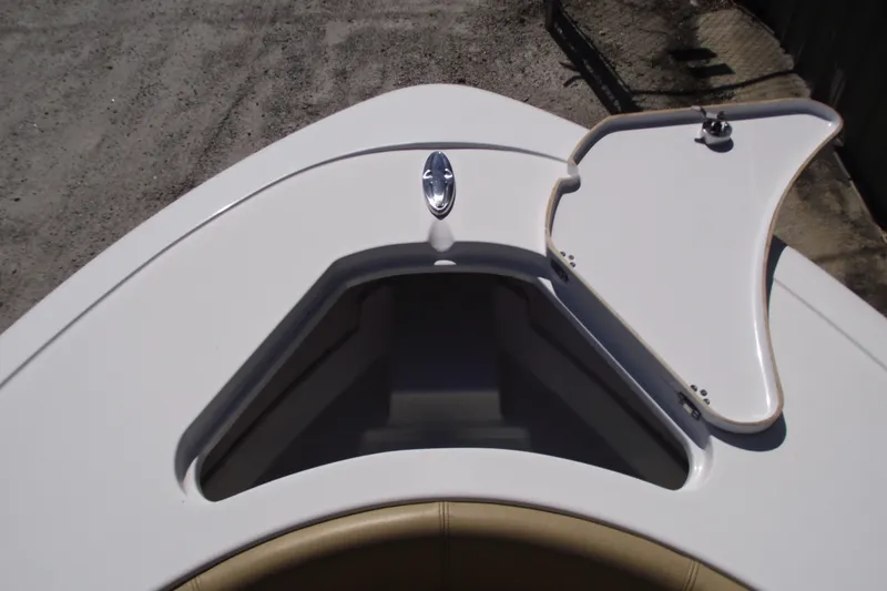 Slide: The Image of 2022 Sportsman Open 232 Center Console boat bow storage compartment open. - 7