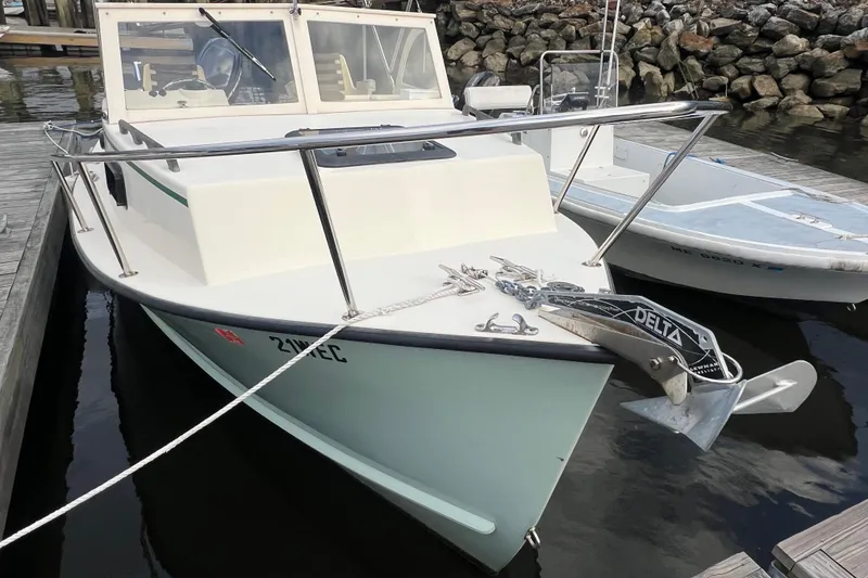 Slide: The Image of 2018 Seaway 21 Seafarer Cuddy boat docked with anchor and ropes. - 10