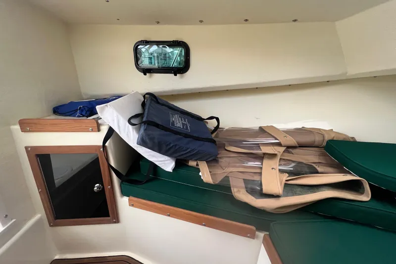 Slide: The Image of 2018 Seaway 21 Seafarer Cuddy interior with cushions and life jackets. - 6